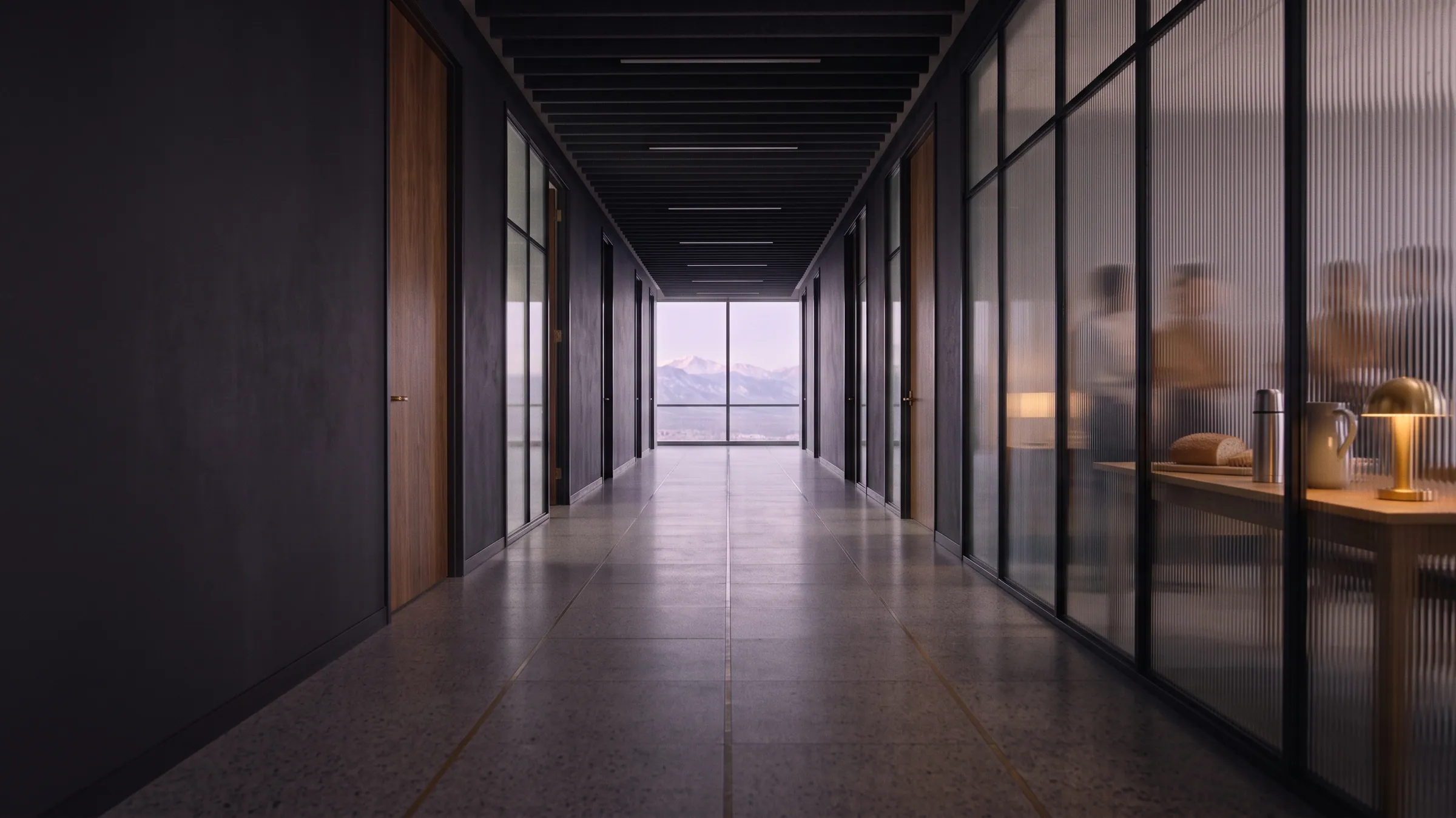 The corridor at midday, with the long lunch table visible through ribbed glass.
